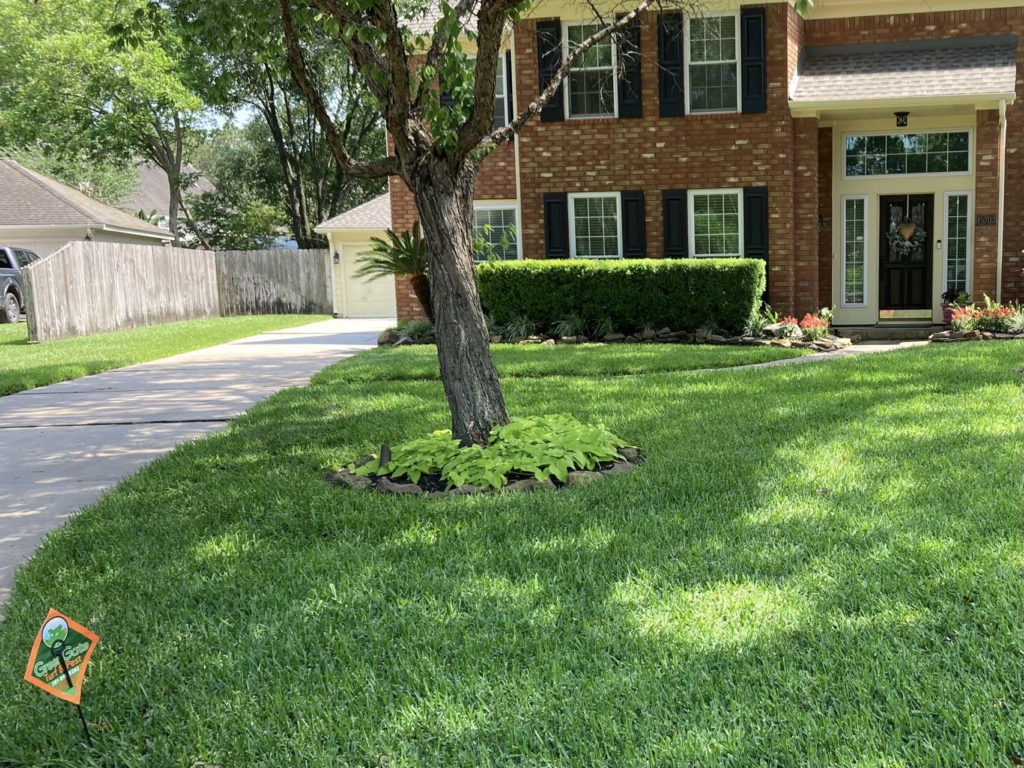 Sprinkler system efficiently watering a well-maintained lawn in Houston, TX