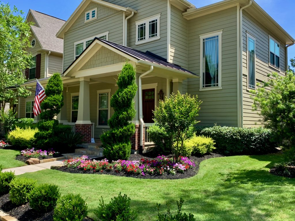 front of home with flower bed liquid aeration results