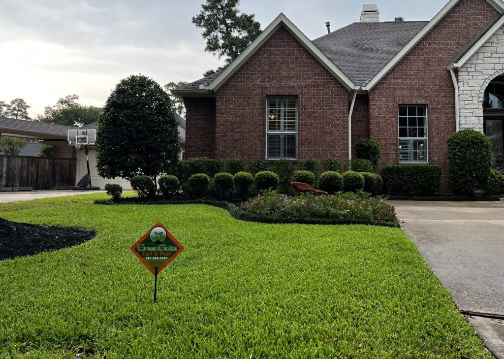 An Exterior View of a House Showcasing Lawn Aeration by Greengate Turf & Pest in Cypress, TX