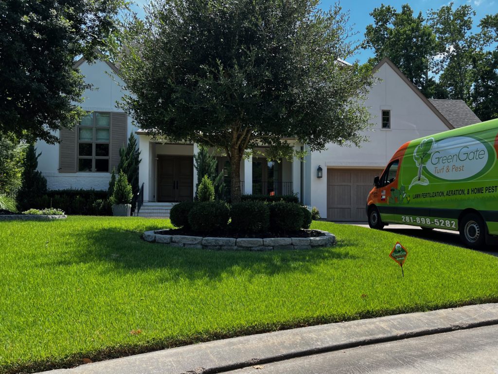 GreenGate truck in a driveway of a home with a green, lush lawn after a Missouri City Mosquito Control service