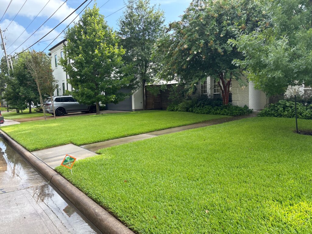 Lawn Aeration Services by GreenGate Turf & Pest with a GreenGate lawn sign in the yard