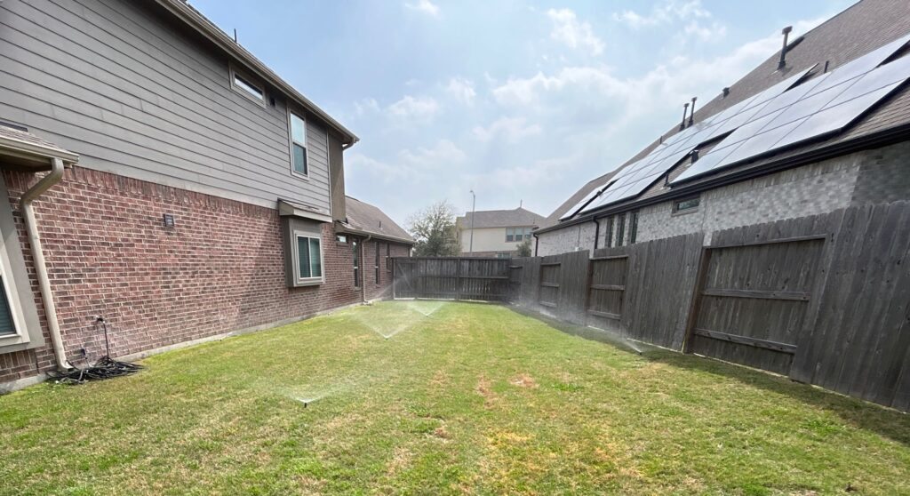 Sprinkler system running during a sprinkler service call in Richmond, TX | Lawn sprinkler service near me