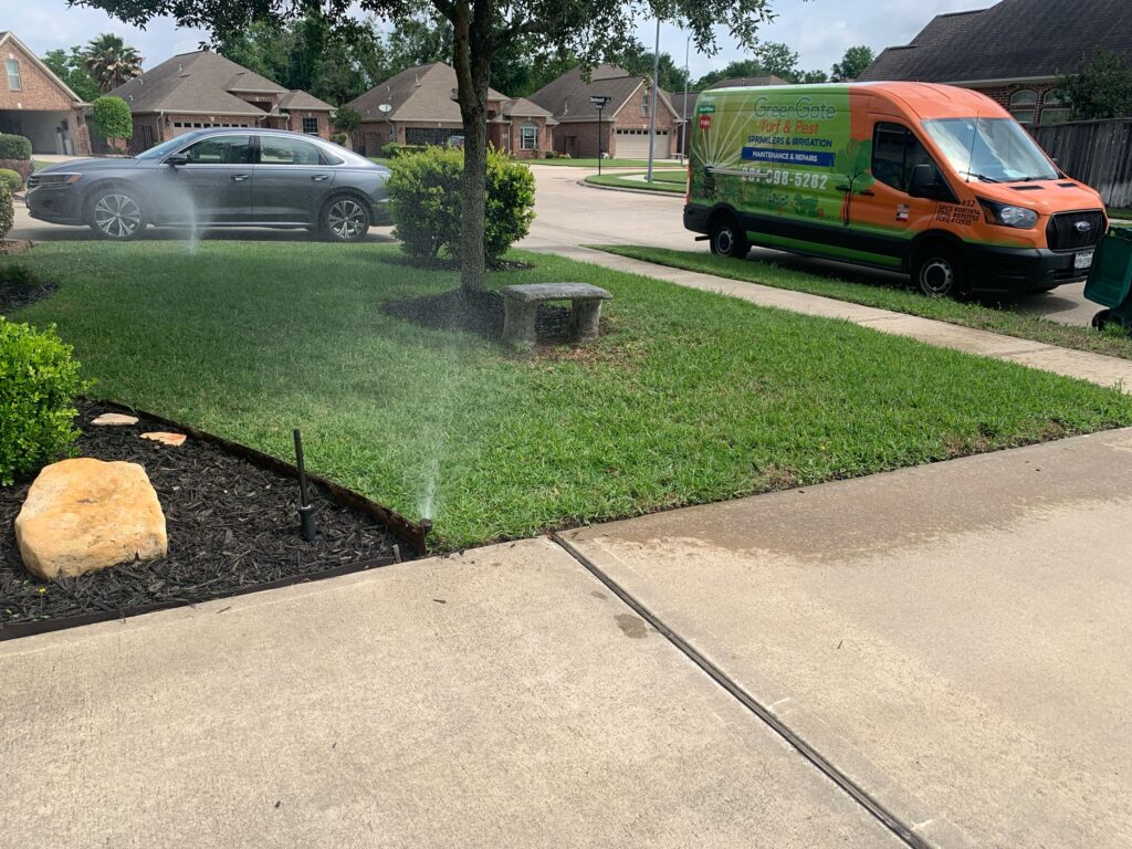 Sprinklers running and being tested by a greengate technician