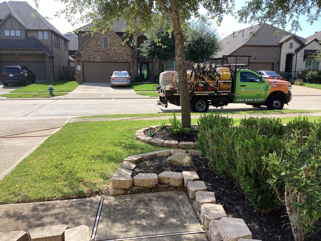 GreenGate performing lawn care services in Richmond, TX, including lawn fertilization, ant control services, chinch bug treatment, sod webworm treatment, grub control